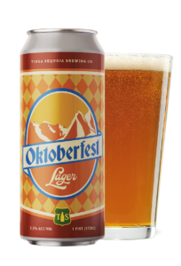 Can of Oktoberfest Lager from Tioga Sequoia featuring mountains on the label in brown and orange color theme. Pint glass filled with the beer is next to the can